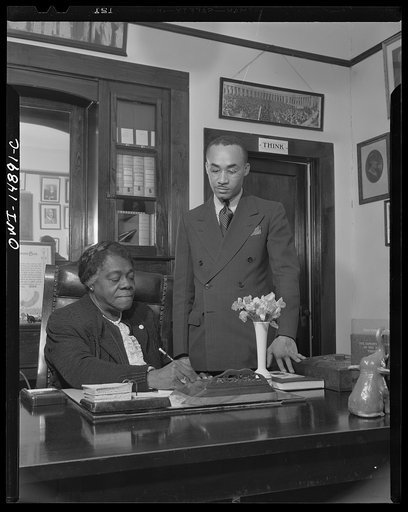 Daytona Beach, Florida. Bethune-Cookman College. Dr. Mary McLeod Bethune, founder and former president, turning over her office to Mr. James Colston, recently selected to succeed her as president