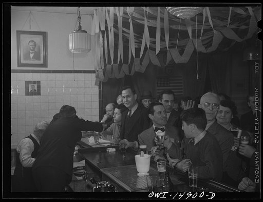 New York, New York. Saturday night gathering of the members of the Venetia Giulia fraternity, an International Workers' Order section made up of Italians from the southern Austria. The organization gives them sickness insurance and other benifits. Drinking beer at a bar adorned with portraits of Lin