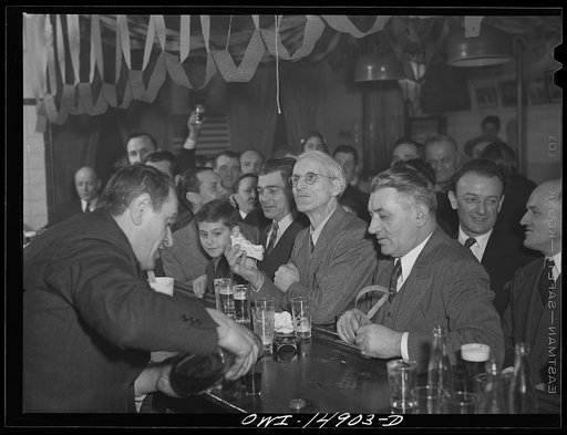 New York, New York. Saturday night gathering of the members of the Venetia Giulia fraternity, an International Workers' Order section made up of Italians from the southern section of Austria. The organization gives them sickness insurance and other benefits. Drinking beer at a bar adorned with portr