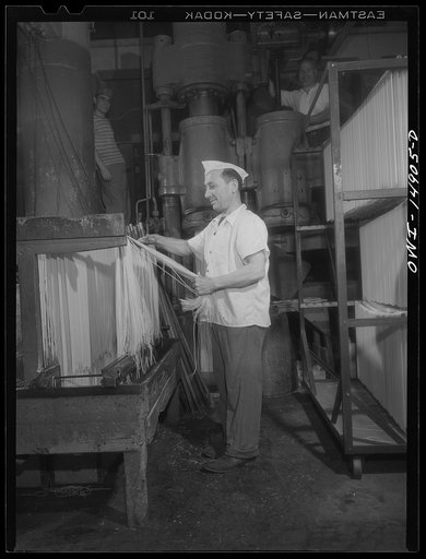 Long Island City, New York. Atlantic Macaroni Company, makers of Caruso brand products. Workers hanging out spaghetti to dry