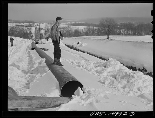 Pennsylvania section of the war emergency twenty-four inch pipeline to carry oil from Texas fields to eastern refineries, completed in July 1943. Straw boss over diggers removing rocks from ditch