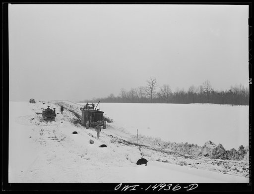 Pennsylvania section of the war emergency twenty-four inch pipeline to carry oil from Texas fields to eastern refineries, completed in July 1943. Ditching machine making a six-foot trench through the right of way