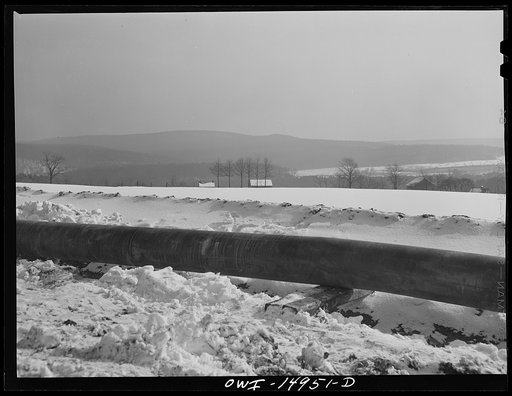 Pennsylvania section of the war emergency twenty-four inch pipeline to carry oil from Texas fields to eastern refineries, completed in July 1943. Welded pipe not yet laid in the ditch