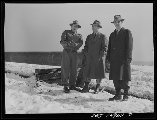 Pennsylvania section of the war emergency twenty-four inch pipeline to carry oil from Texas fields to eastern refineries, completed in July 1943. The president and vice-president of the Oklahoma contracting company with Mr. Link, a transportation man from the defense plants corporation