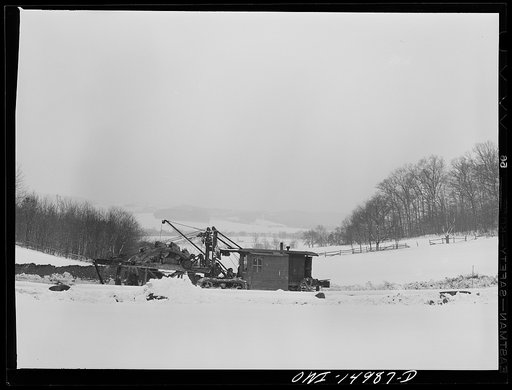Pennsylvania section of the war emergency twenty-four inch pipeline to carry oil from Texas fields to eastern refineries, completed in July 1943. Ditching machine going through the right of way. This machine digs a six-foot trench