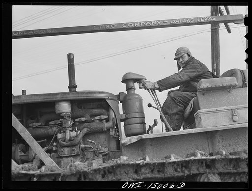 Pennsylvania section of the war emergency twenty-four inch pipeline to carry oil from Texas fields to eastern refineries, completed in July 1943. Caterpillar operator on the right of way gang