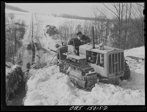 Pennsylvania section of the war emergency twenty-four inch pipeline to carry oil from Texas fields to eastern refineries, completed in July 1943. Caterpillar tractor and operator