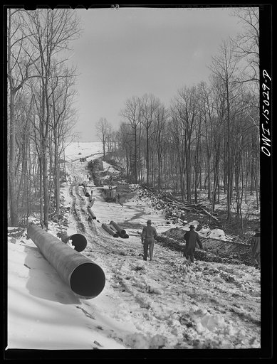 Pennsylvania section of the war emergency twenty-four inch pipeline to carry oil from Texas fields to eastern refineries, completed in July, 1943. Cutting the right of way through woods