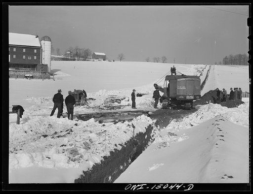 Pennsylvania section of the war emergency twenty-four inch pipeline to carry oil from Texas fields to eastern refineries, completed in July, 1943. Making a road over the ditch passable