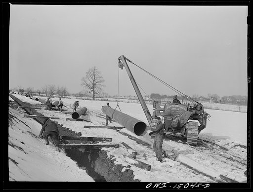 Pennsylvania section of the war emergency twenty-four inch pipeline to carry oil from Texas fields to eastern refineries, completed in July, 1943. Preparing to join a section of pipe to the main line