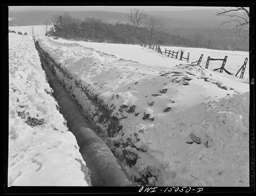 Pennsylvania section of the war emergency twenty-four inch pipeline to carry oil from Texas fields to eastern refineries, completed in July, 1943. Pipe laid and awaiting backfilling