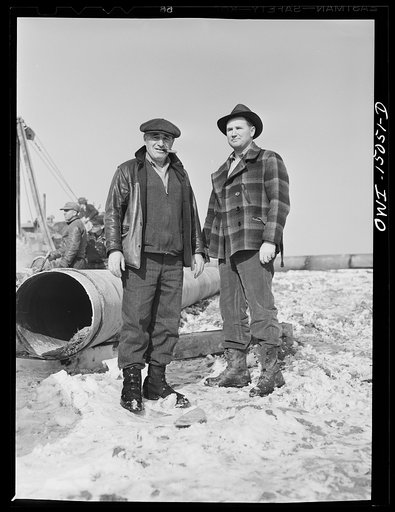 Pennsylvania section of the war emergency twenty-four inch pipeline to carry oil from Texas fields to eastern refineries, completed in July, 1943. Superintendent and laying-in boss on one section of the pipeline