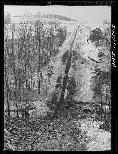 Pennsylvania section of the war emergency twenty-four inch pipeline to carry oil from Texas fields to eastern refineries, completed in July, 1943. Ditch for the pipeline in  hilly country