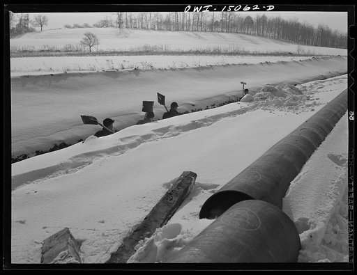 Pennsylvania section of the war emergency twenty-four inch pipeline to carry oil from Texas fields to eastern refineries, completed in July, 1943. Gang clearing rocks out of the ditch