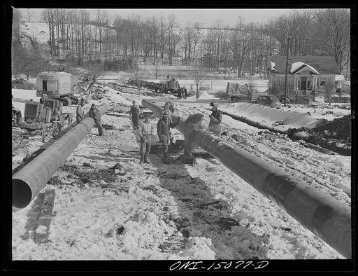Pennsylvania section of the war emergency twenty-four inch pipeline to carry oil from Texas fields to eastern refineries, completed in July, 1943. Welding together forty-foot section of pipe