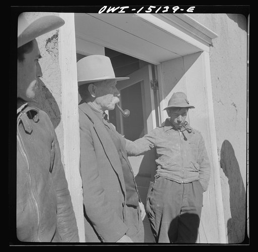 Untitled photo, possibly related to: Chacon, Mora County, New Mexico. Idlers at the general store