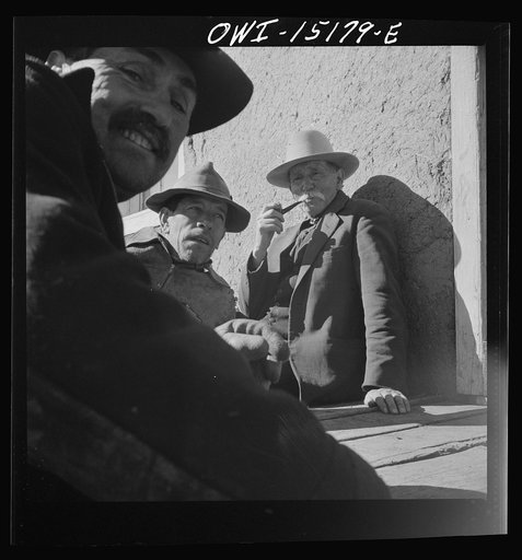 Chacon, Mora County, New Mexico. Idlers at the general store
