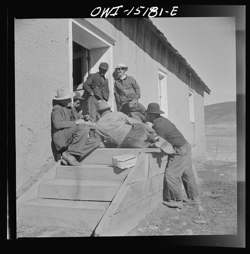 Chacon, Mora County, New Mexico. Idlers at the general store