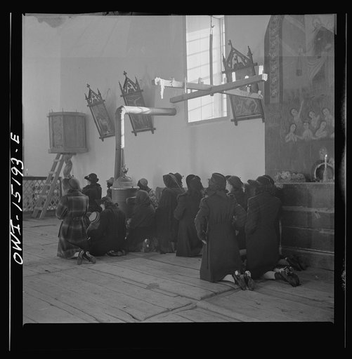 Trampas, New Mexico. Father Cassidy conducting mass at a church which was built in 1700 and is the best-preserved colonial mission in the Southwest