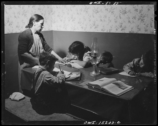 Trampas, New Mexico. Mrs. Maclovia Lopez, can read and write English well; she also keeps the family books in the evening and helps the children with their homework