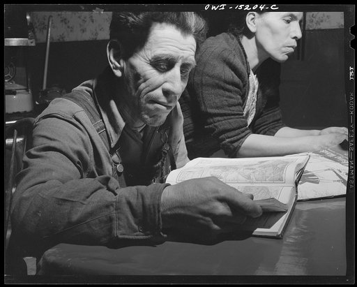 Trampas, New Mexico. Juan Lopez, the majordomo (mayor) [i.e., steward], cannot read English, but pictures of other lands and maps of the world fascinate him