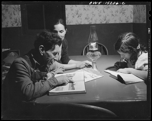 Trampas, New Mexico. Juan Lopez, the majordomo (mayor) [i.e., steward], cannont read English, but pictures of other lands and maps of the world fascinate him