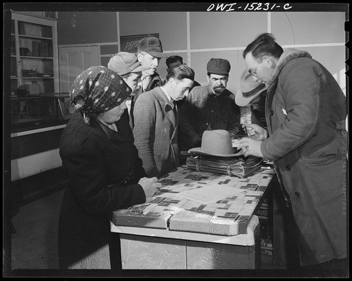 Chacon, New Mexico. United States forest ranger in the general store issuing grazing permits to Spanish-American ranchers
