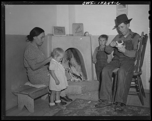 Trampas, New Mexico. The Lopez home is many generations old, and this fireplace has been the only form of heating its inhabitants have known