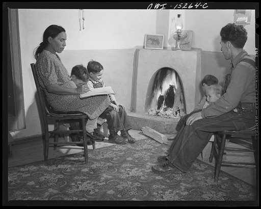 Trampas, New Mexico. The temperature in Trampas drops way below zero in winter, and all social life takes place around the fire. An evening scene in the home of Juan Lopez, the majordomo (mayor) [i.e., steward