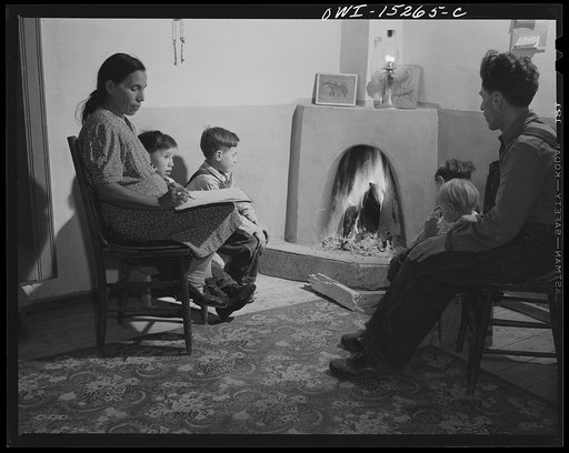 Untitled photo, possibly related to: Trampas, New Mexico. The temperature in Trampas drops way below zero in winter, and all social life takes place around the fire. An evening scene in the home of Juan Lopez, the majordomo (mayor) [i.e., steward