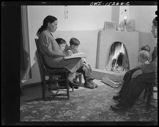Untitled photo, possibly related to: Trampas, New Mexico. The temperature in Trampas drops way below zero in winter, and all social life takes place around the fire. An evening scene in the home of Juan Lopez, the majordomo (mayor) [i.e., steward