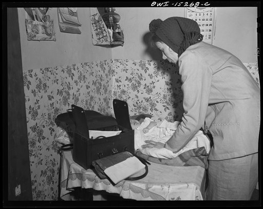 Untitled photo, possibly related to: Llano Quemado (vicinity), New Mexico. Marjorie Muller, nurse from the clinic operated by the Taos County cooperative health association, making a home call