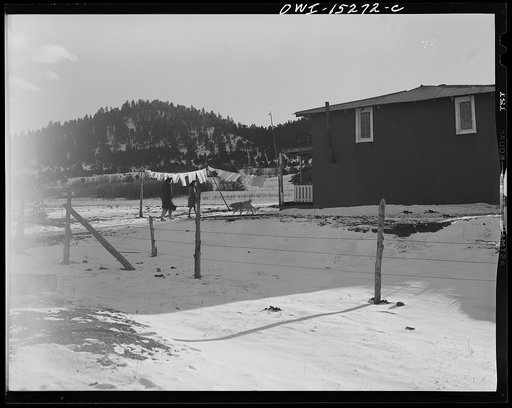 Llano Quemado (vicinity), New Mexico. Marjorie Muller, nurse from the clinic operated by the Taos County cooperative health association, and an interpreter arriving at a patient's house