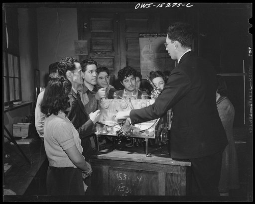 Untitled photo, possibly related to: Taos County, New Mexico. Father Cassidy, the Catholic priest of the Parish of Penasco, teaching a general science class in the high school