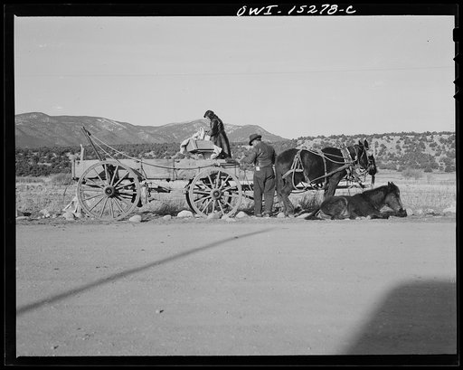 Penasco, New Mexico. Spanish-American family arriving in a wagon with a sick child at the clinic operated by the Taos County cooperative health association