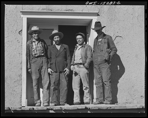 Chacon, Mora County, New Mexico. Idlers on the general store steps