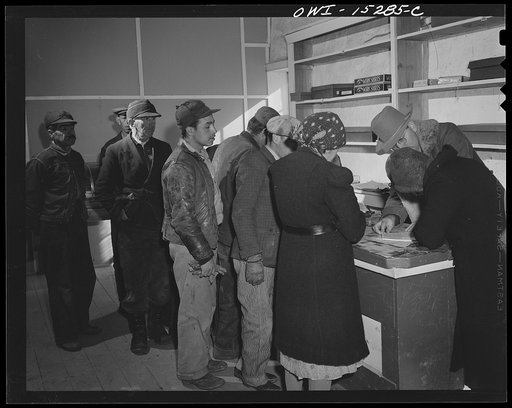 Untitled photo, possibly related to: Chacon, Mora County, New Mexico. United States forest ranger in the general store issuing grazing permits to Spanish-American ranchers