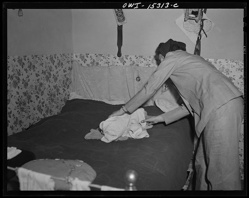 Untitled photo, possibly related to: Llano Quemado (vicinity), New Mexico. Marjorie Muller, nurse from the clinic operated by the Taos County cooperative health association, making a home call