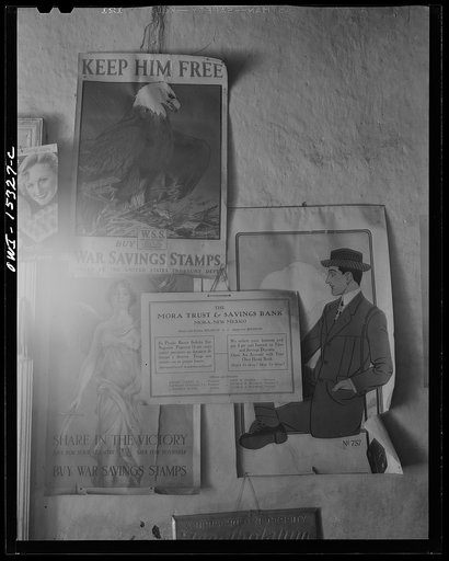 Untitled photo, possibly related to: Chacon, Mora County, New Mexico. Posters of the first world war which have never been removed from the wall of the general store