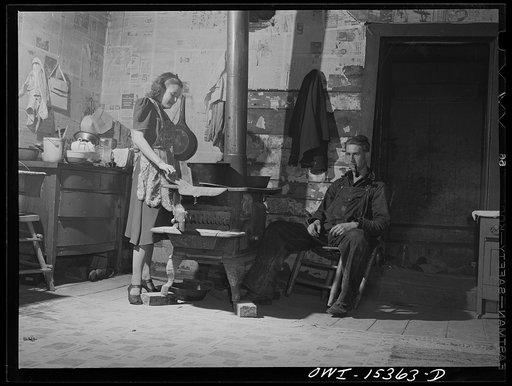 Rio Grande, Gallia County, Ohio. Reed Hall and his wife, Evelyn, in their home in the hill section before moving to 500 acre dairy farm where Mr. Hall received employment as a result of his training at Rio Grande College