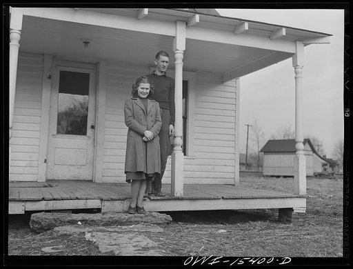 Rio Grande, Ohio. Reed Hall and his wife Evelyn on the porch of a new tenant home on 500 acre dairy farm in Gallia County, Ohio, where they were placed after Mr. Hall attended farm labor training school at Rio Grande College, Ohio