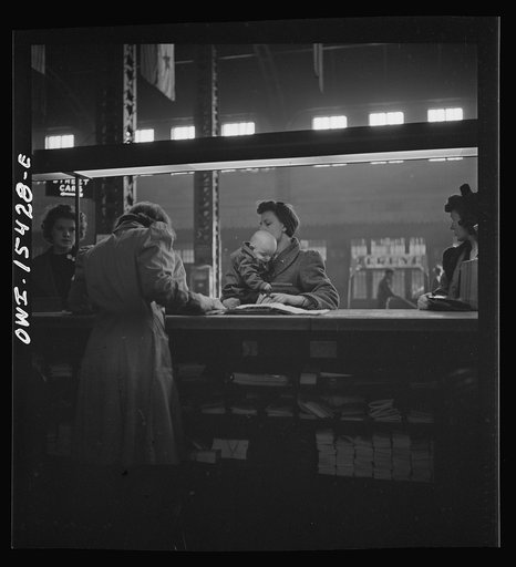 Untitled photo, possibly related to: Chicago, Illinois. At the information booth at Union Station