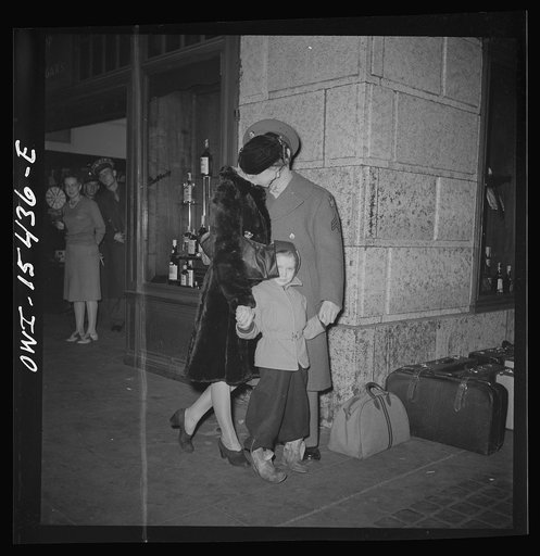 Chicago, Illinois. Soldier and his family waiting for a train at the Union Station