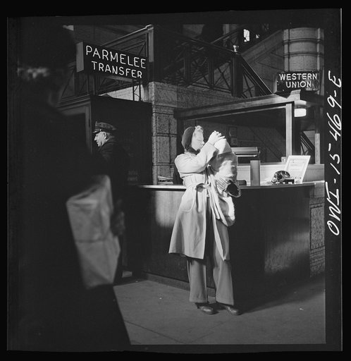 Untitled photo, possibly related to: Chicago, Illinois. Waiting for a train in the concourse of the Union Station. Parmelee transfer sign
