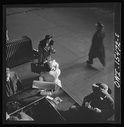 Untitled photo, possibly related to: Chicago, Illinois. Waiting for a train in the concourse of the Union Station. Parmelee transfer sign