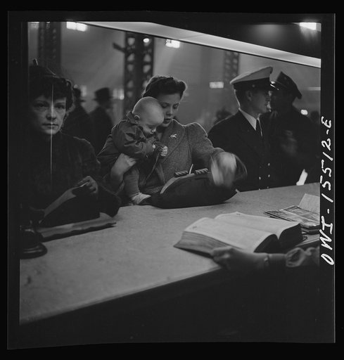 Untitled photo, possibly related to: Chicago, Illinois. At the information booth at Union Station