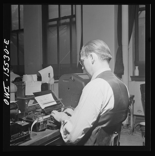 Chicago, Illinois. In the Pennsylvania Railroad telegraph room at the Union Station