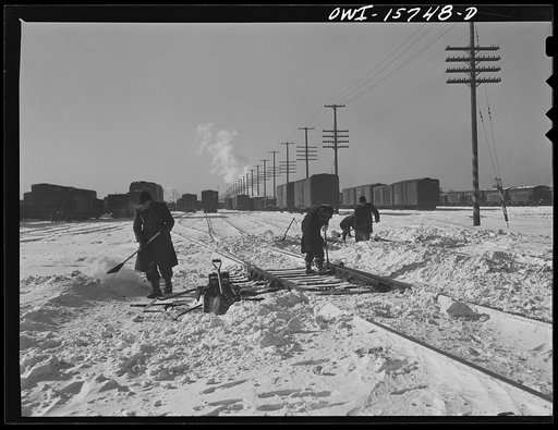 Chicago, Illinois. Cleaning out switches on a cold winter day at the clearing yard. Belt Railway Company of Chicago