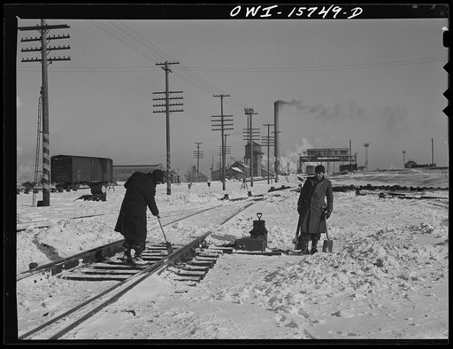 Chicago, Illinois. Cleaning out switches on a cold winter day at the clearing yard. Belt Railway Company of Chicago