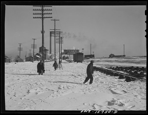 Chicago, Illinois. Workmen going out to clean switches on a cold winter day at the clearing yard. Belt Railway Company of Chicago